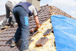 roofer laying tile roof 1 scaled uai roofer laying tile roof 1 scaled uai